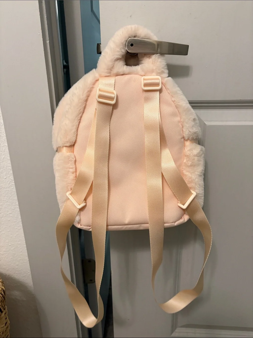 Nike Plush Faux-Fur Mini Backpack in Cream with Black Swoosh